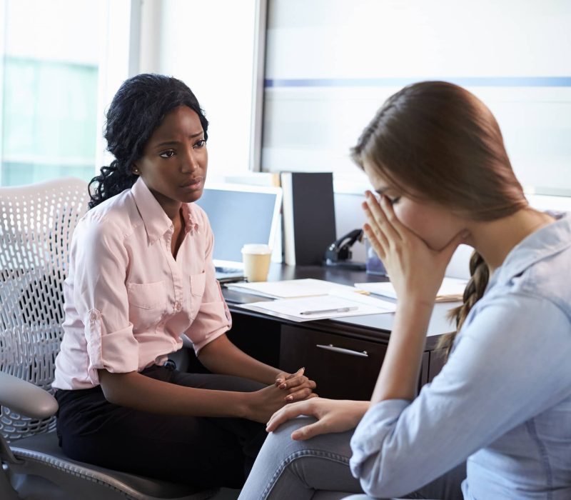 Doctor In Consultation With Depressed Female Teen Patient