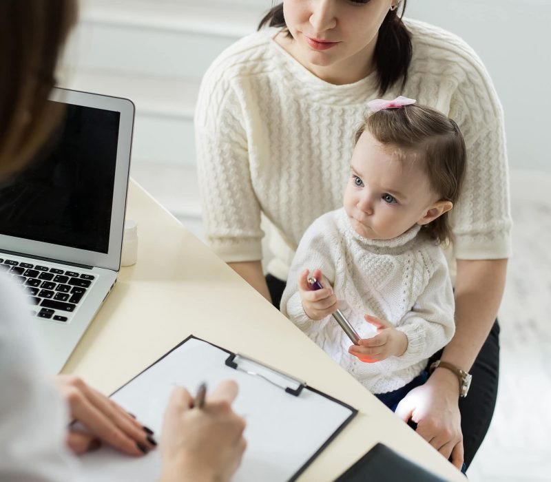 Pediatrician Meeting With Mother And Child In Hospital